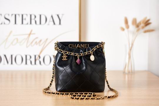 Chanel Mini Drawstring Bucket Bag with Charms in Black Quilted Leather