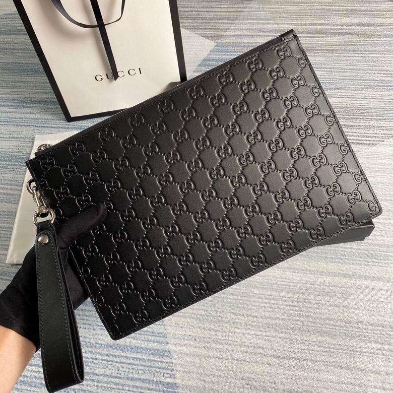Gucci Signature Zip Pouch Clutch with Wrist Strap in Black Embossed Leather
