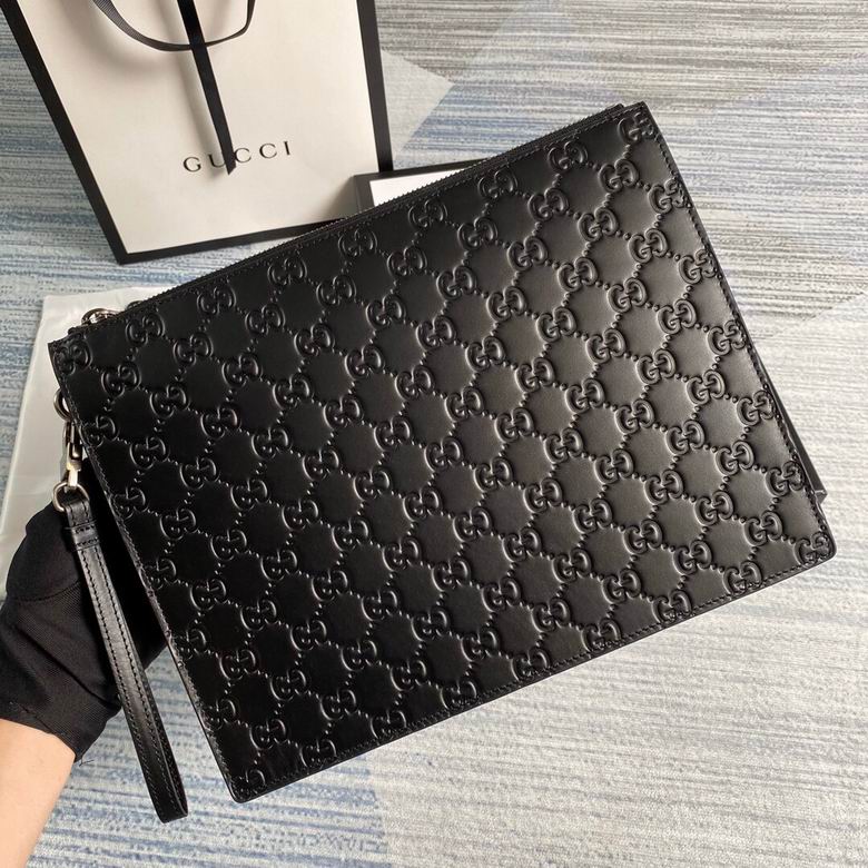 Gucci Signature Zip Pouch Clutch with Wrist Strap in Black Embossed Leather