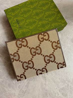 Gucci Jumbo GG Pouch Clutch in Beige and Camel Canvas