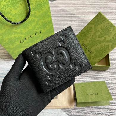 Gucci Jumbo GG Bi-Fold Wallet in Black Embossed Leather