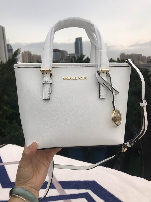 Michael Kors Jet Set Travel · 28×23×19 cm