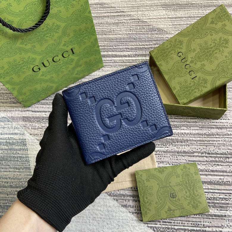 Gucci Jumbo GG Bi-Fold Wallet in Navy Blue Embossed Leather