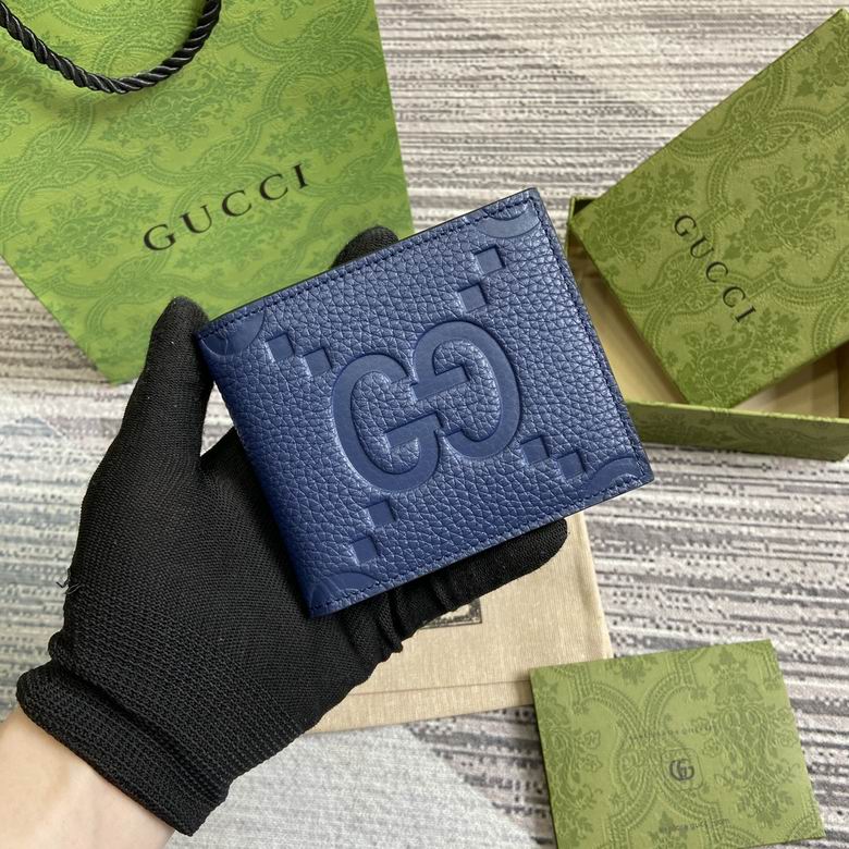 Gucci Jumbo GG Bi-Fold Wallet in Navy Blue Embossed Leather
