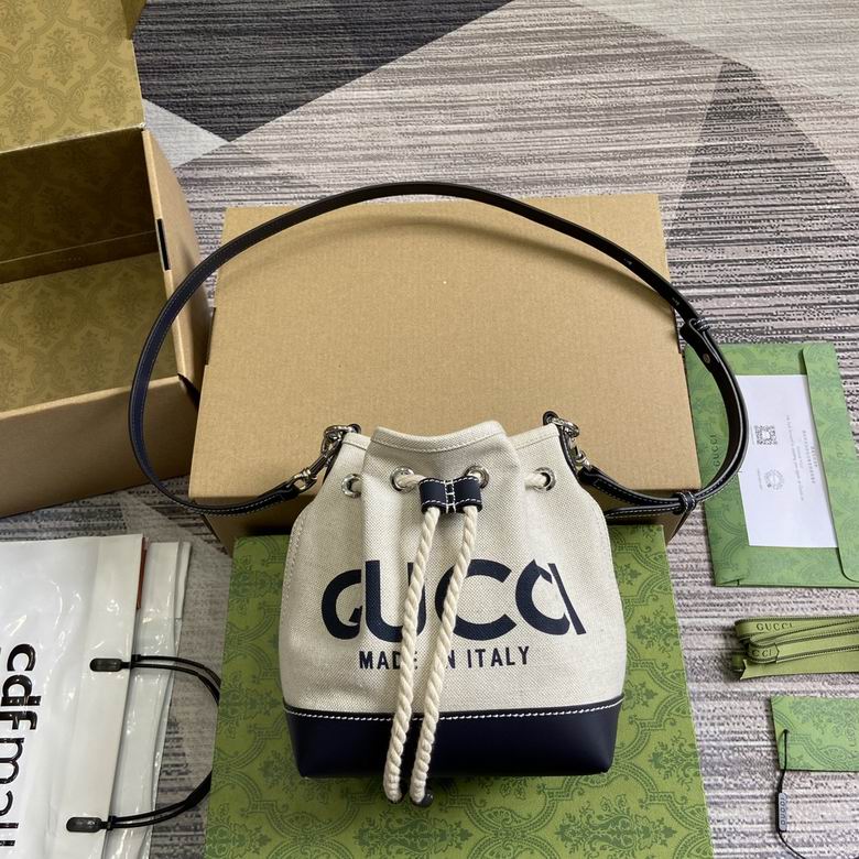 Gucci Mini Drawstring Bucket Bag in Ivory Canvas with Navy Leather and Logo Print