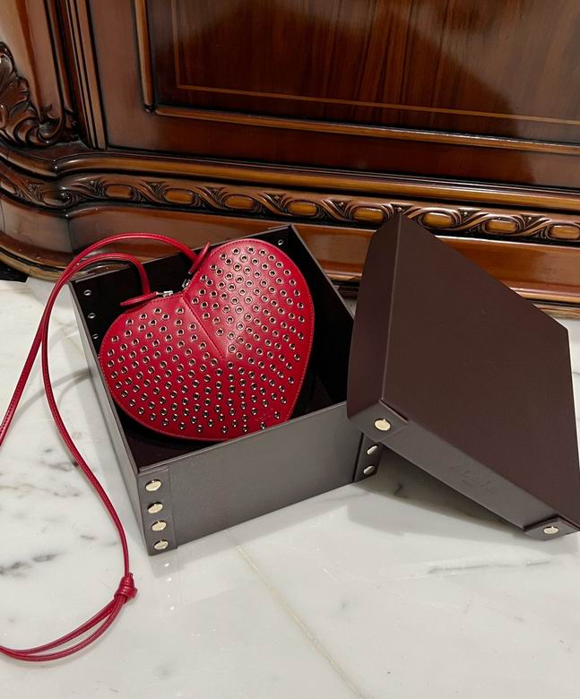 Alaïa Le Cœur Heart-Shaped Crossbody Bag in Red Perforated Eyelet Leather