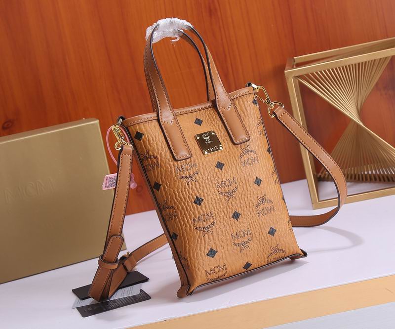 MCM Mini Vertical Tote Bag with Crossbody Strap in Cognac Visetos
