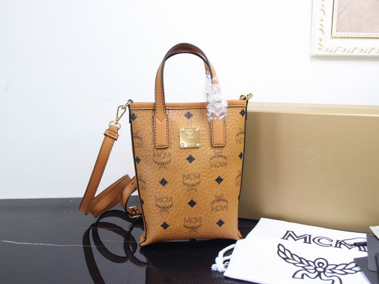 MCM Mini Vertical Tote Bag with Crossbody Strap in Cognac Visetos Monogram