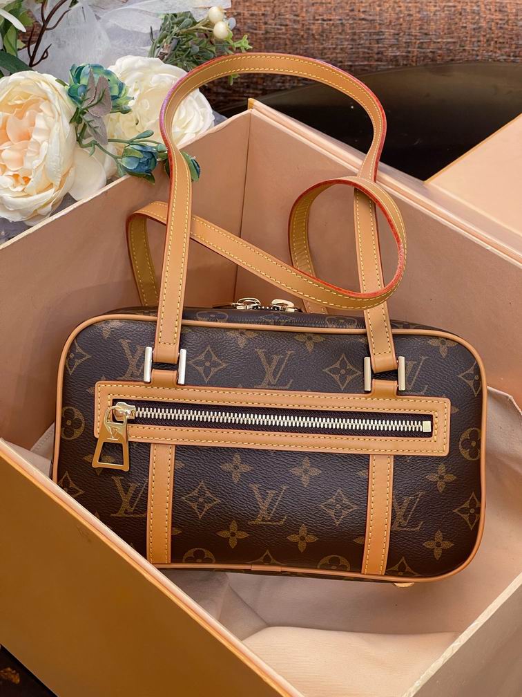 Louis Vuitton Cité Shoulder Bag in Monogram Canvas with Tan Leather Handles